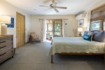 Primary bedroom with adjacent screened porch for nice bug-free breezes at night